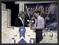 Phillip gracefully accepts his Golden Egg from Noel Edmonds.